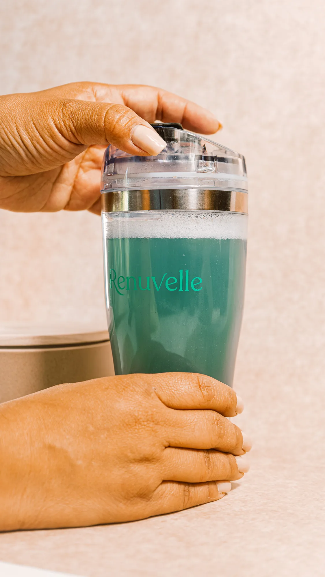 The Renuvelle shaker flask in hand